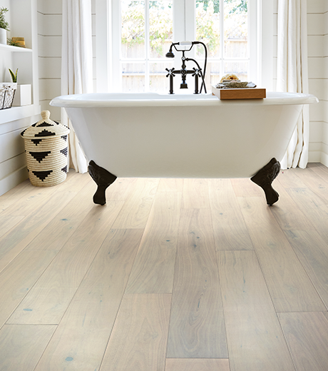 Bathtub on wood-look luxury vinyl flooring from A Touch Of Magic Flooring in Emerald Isle, NC