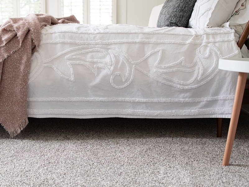 Bedroom with gray carpet from A Touch Of Magic Flooring in Emerald Isle, NC