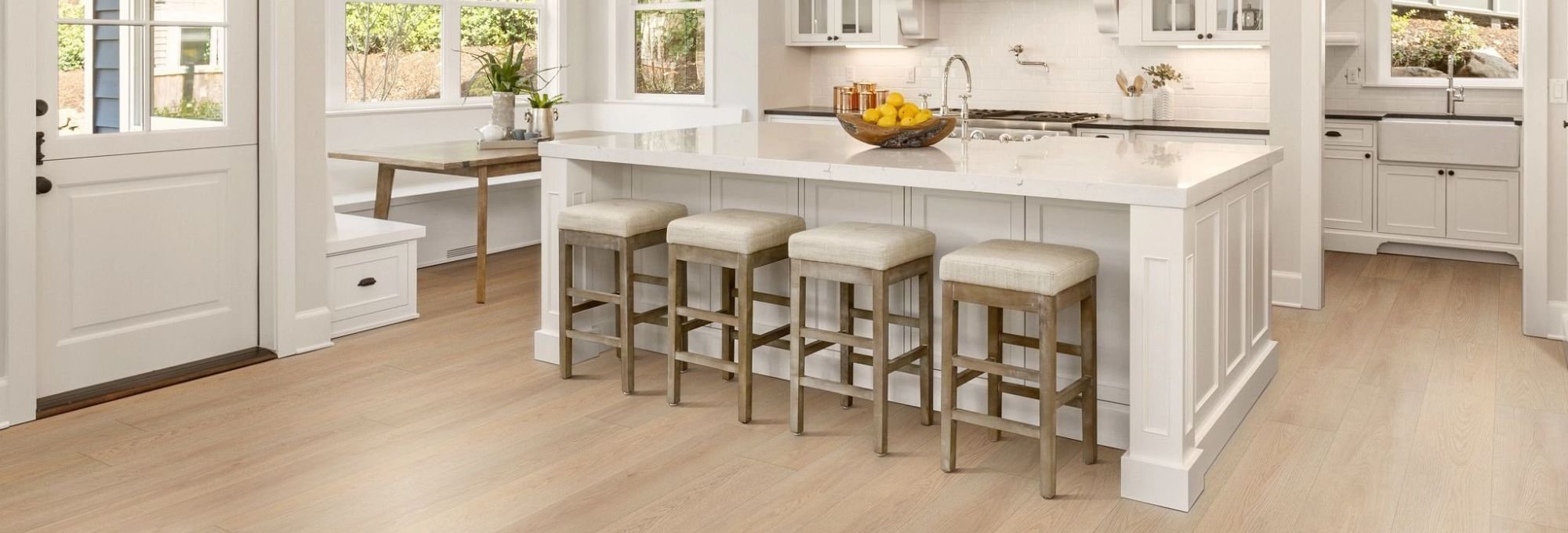 Kitchen dining room with wood look luxury vinyl flooring from A Touch Of Magic Flooring in Emerald Isle, NC