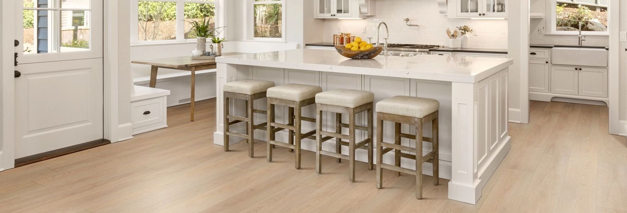 Kitchen dining room with wood look luxury vinyl flooring from A Touch Of Magic Flooring in Emerald Isle, NC