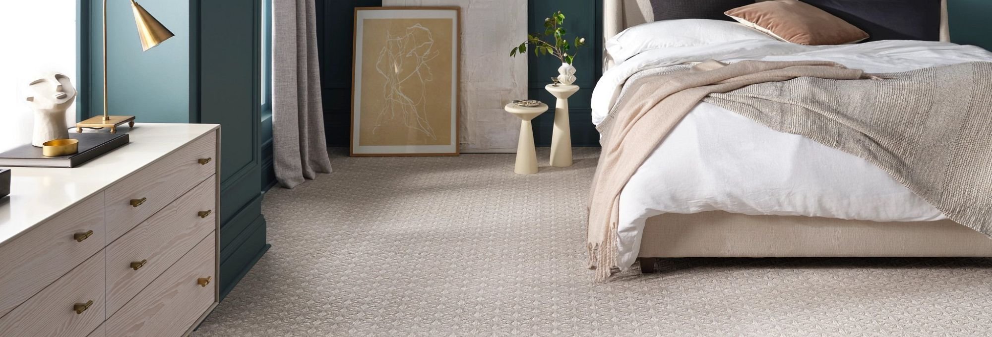 Bedroom with patterned carpet from A Touch Of Magic Flooring in Emerald Isle, NC