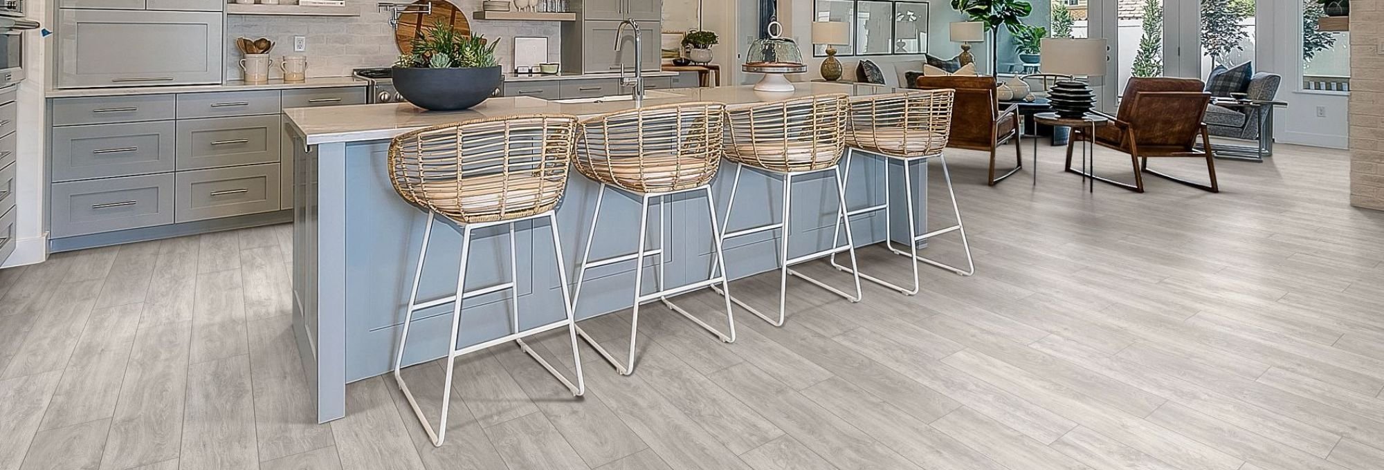 Kitchen dining room with wood-look laminate flooring from A Touch Of Magic Flooring in Emerald Isle, NC